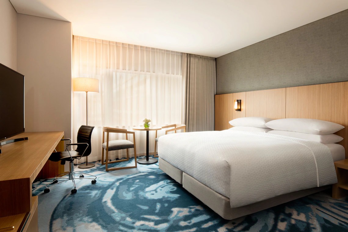 Guest room with bed and seating area